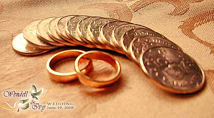 Wedding Rings and Coins A pair of gold wedding rings and 13 gold coins was